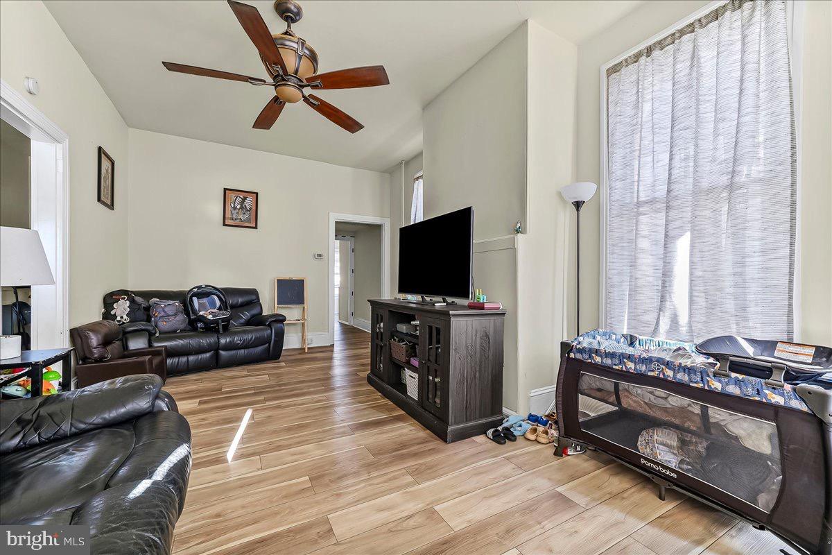 217 West Main Street Elkton, MD 21921 - Photo 6 of 37 a living room with furniture and a flat screen tv