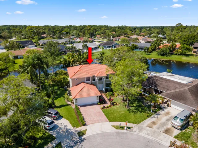 an aerial view of a house with a garden