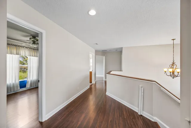 a view of an entryway with wooden floor