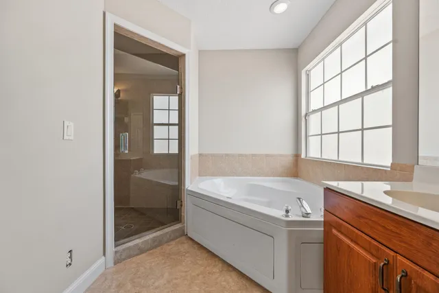 a bathroom with a bathtub and a sink