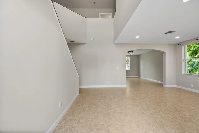 a view of an empty room with a fireplace