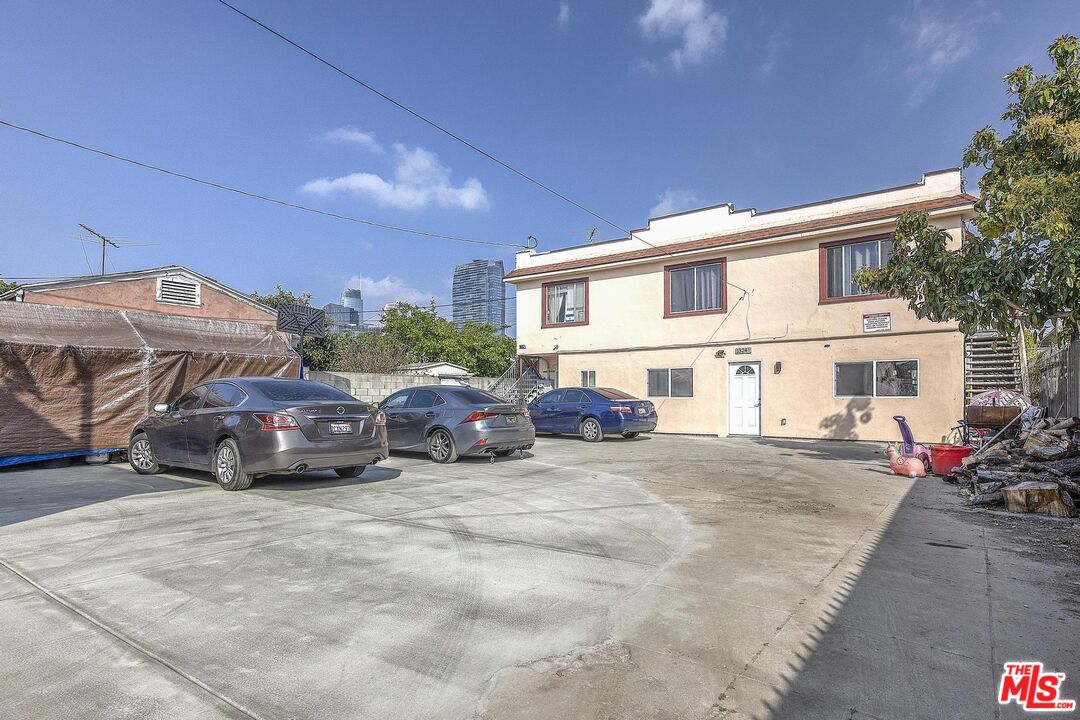 1324 Toberman Street, Unit 1/4 Los Angeles, CA 90015 - Photo 11 of 12 a view of a cars park in front of house