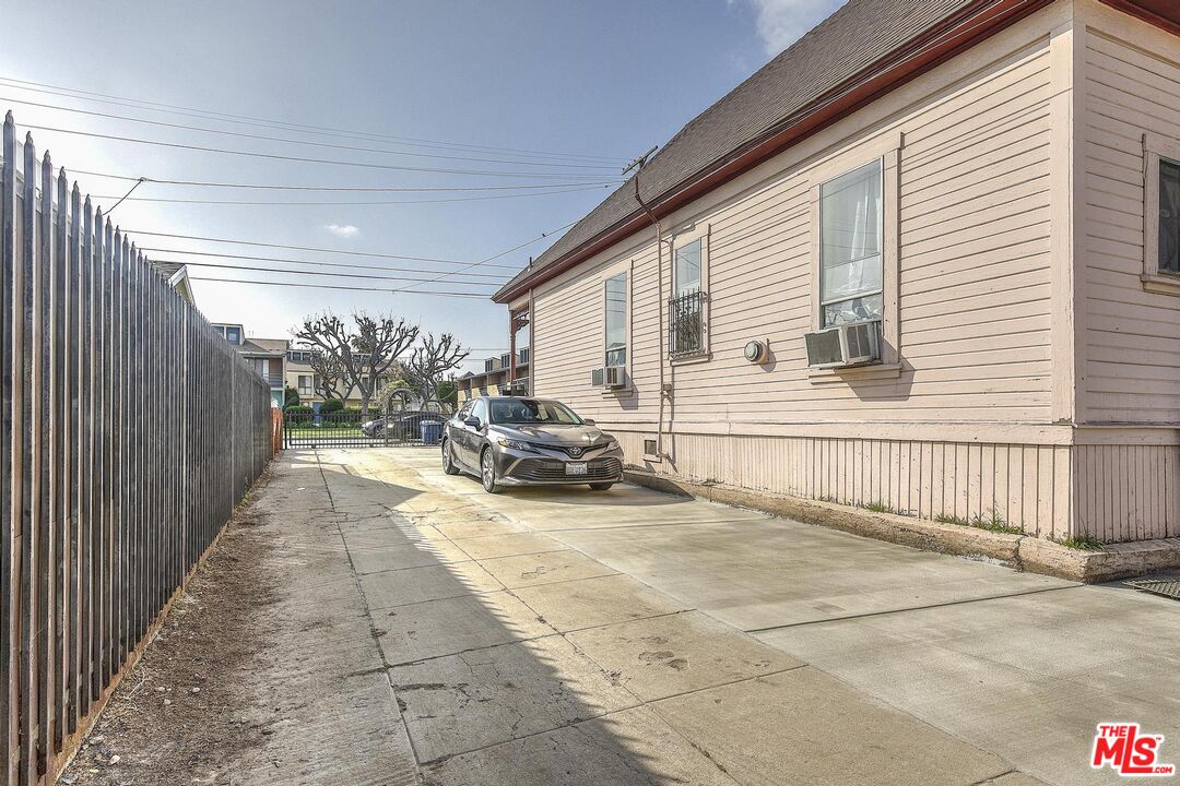 1324 Toberman Street, Unit 1/4 Los Angeles, CA 90015 - Photo 10 of 12 a view of a porch with furniture and floor to ceiling window