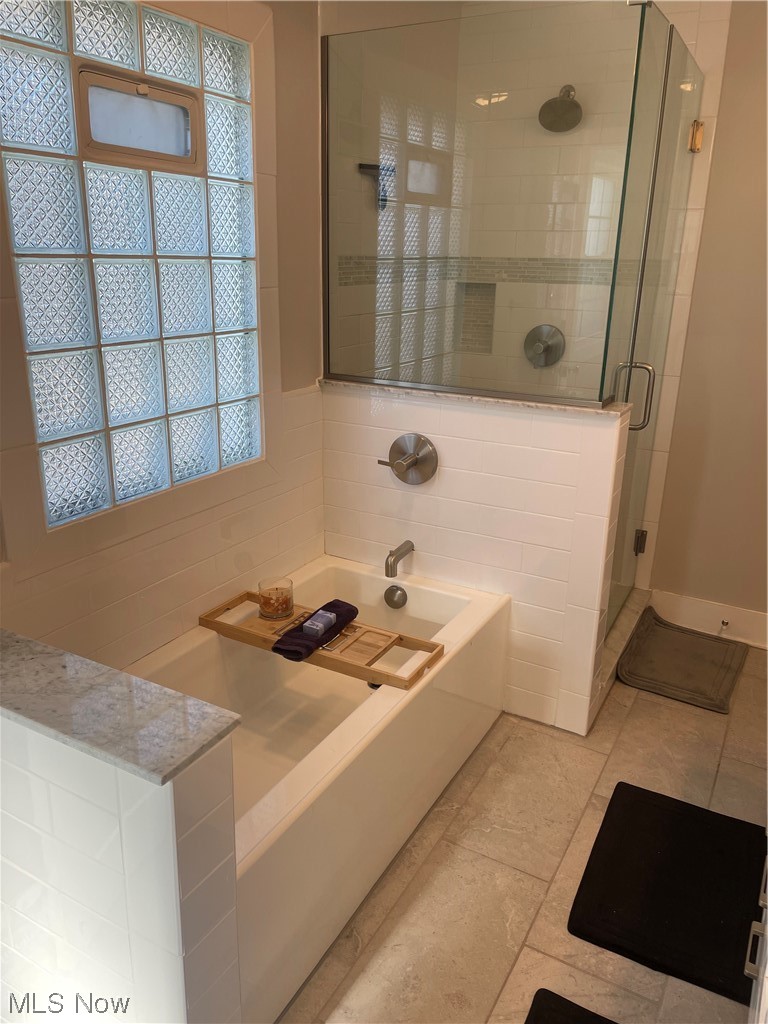 3294 East Overlook Road Cleveland Heights, OH 44118 - Photo 12 of 13 Bathroom featuring tile walls, shower with separate bathtub, and tile flooring