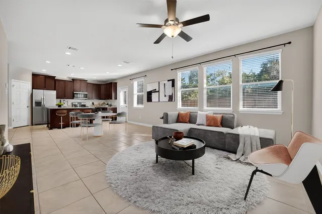 a living room with furniture and a large window