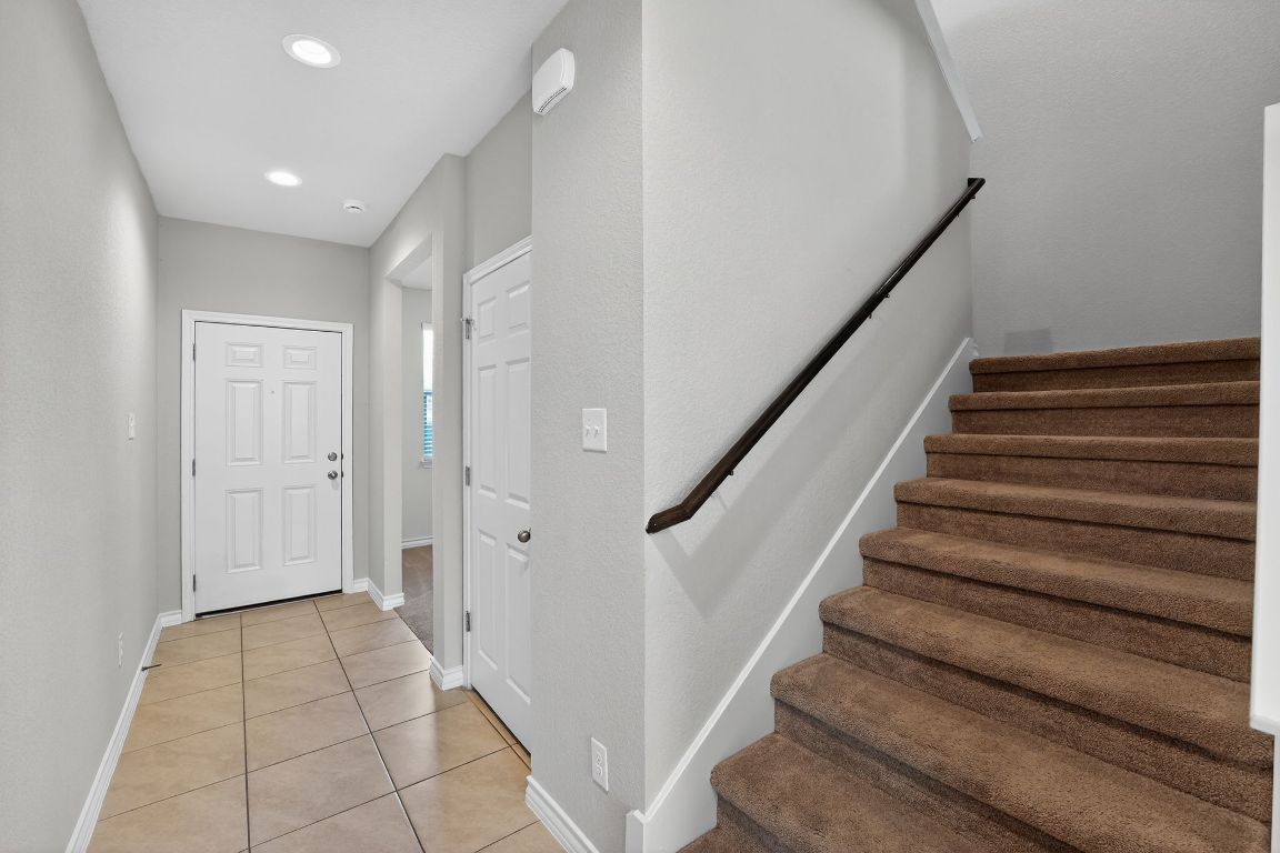 548 Appalachian Trail Leander, TX 78641 - Photo 19 of 38 a view of entryway with wooden floor and stairs