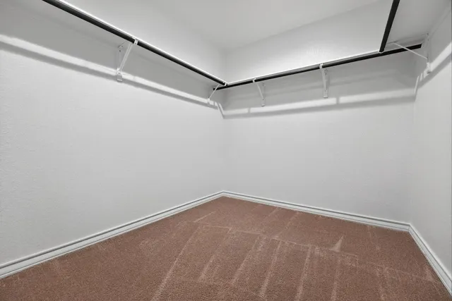 a view of a room with shelf on the wall