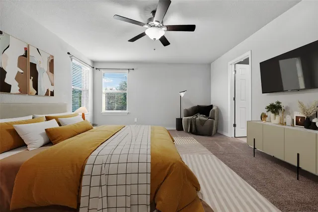 a bedroom with a bed and furniture