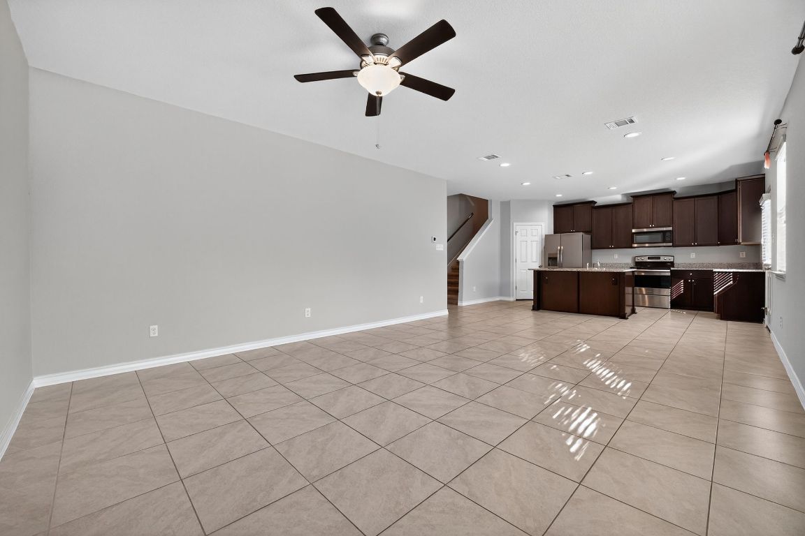 548 Appalachian Trail Leander, TX 78641 - Photo 10 of 38 a view of kitchen with stainless steel appliances a refrigerator and a stove top oven