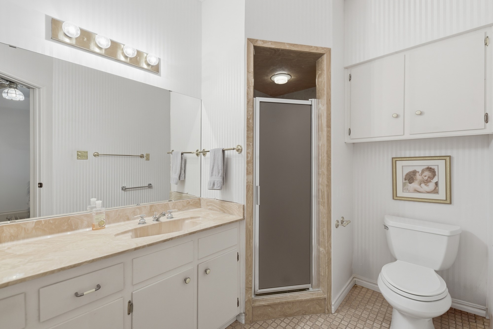 1552 Holub Road Schulenburg, TX 78956 - Photo 27 of 35 Functional bathroom featuring a vanity with a large mirror and an enclosed shower stall.