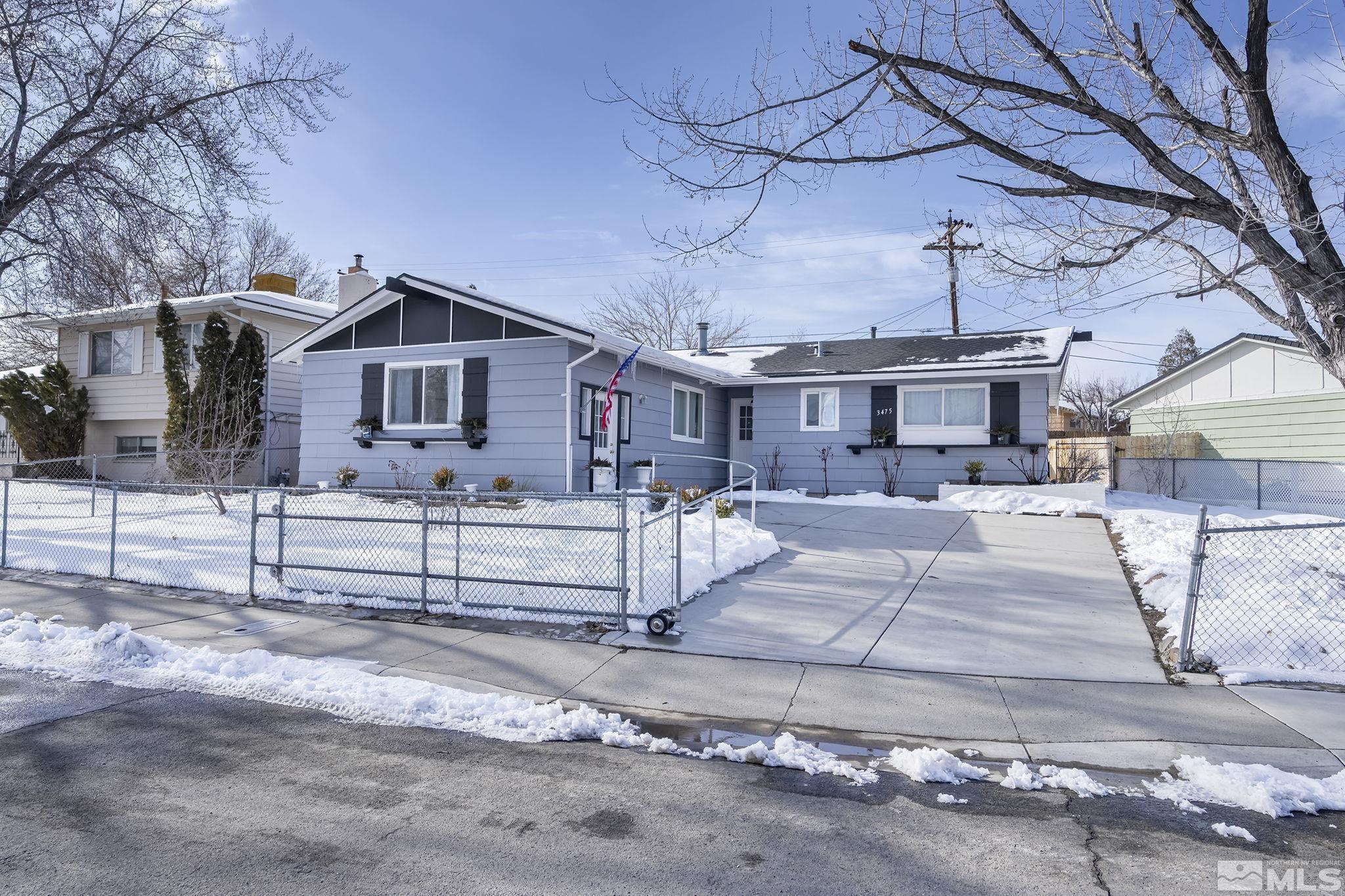 3475 Rauscher Drive Reno, NV 89503 - Photo 1 of 16 a front view of a house with a yard