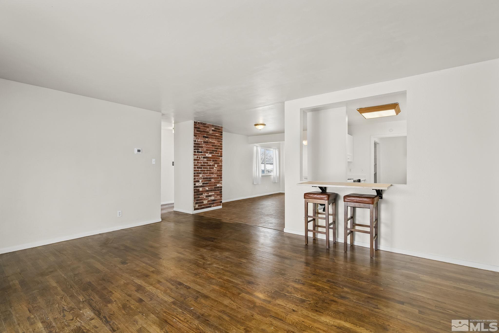 3475 Rauscher Drive Reno, NV 89503 - Photo 5 of 16 a view of a livingroom with furniture and wooden floor