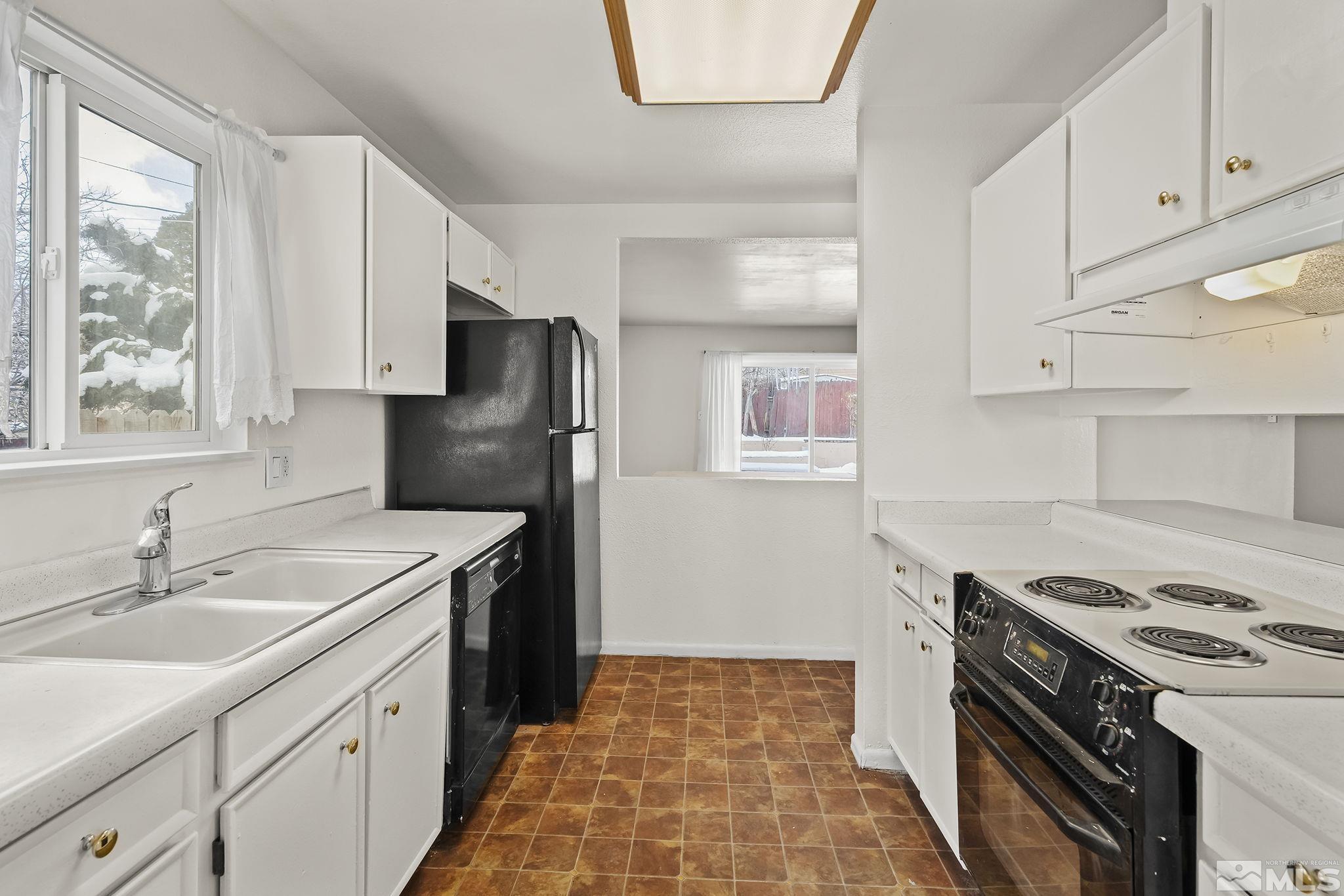 3475 Rauscher Drive Reno, NV 89503 - Photo 8 of 16 a kitchen with a stove sink and refrigerator