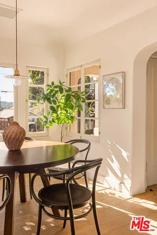 a view of a dining room with furniture and window