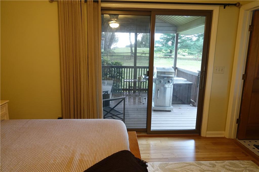 133 Isle Road Butler, PA 16001 - Photo 14 of 25 Master Bedroom has sliding glass doors which lead to a covered rear deck