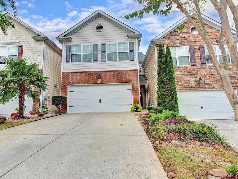 front view of a house with a yard