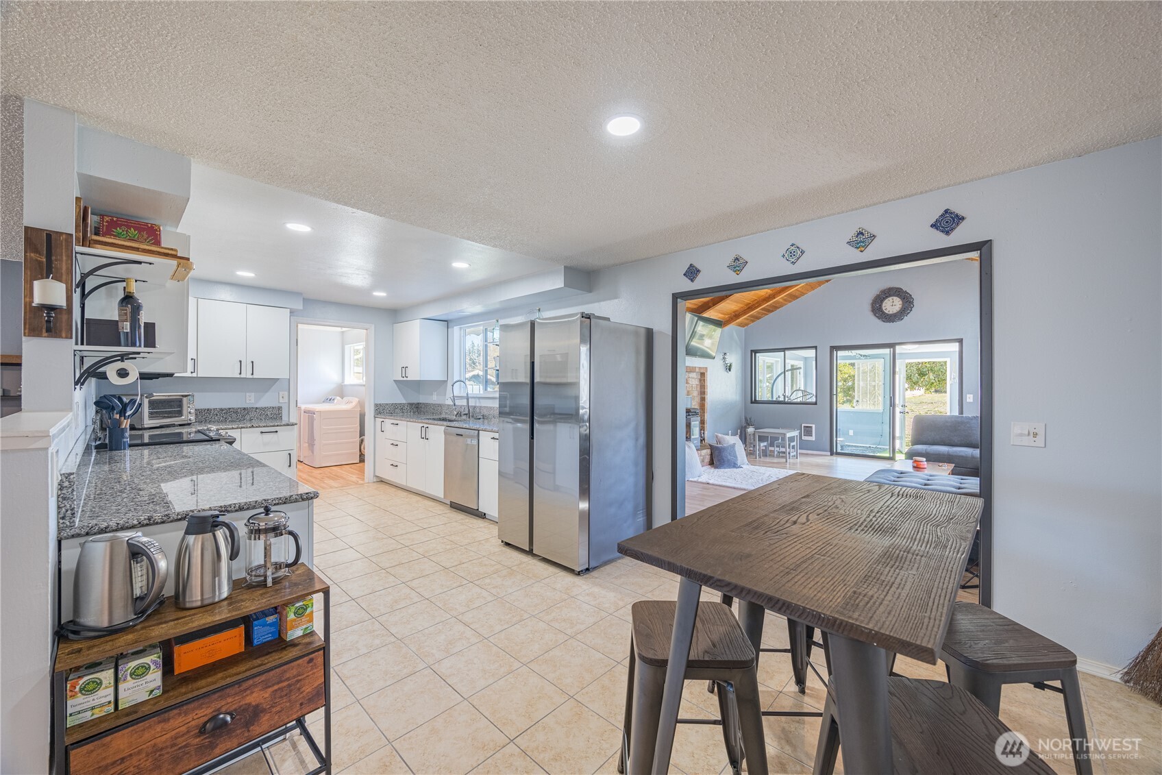 642 Kitchen-Dick Road Sequim, WA 98382 - Photo 11 of 40 a open kitchen with stainless steel appliances granite countertop a stove and refrigerator