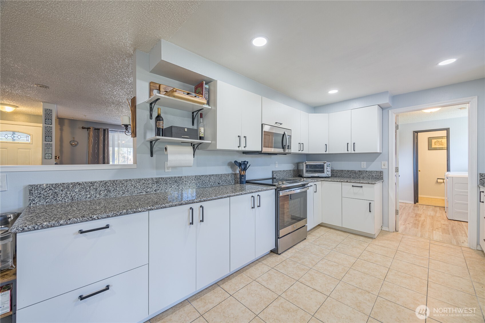 642 Kitchen-Dick Road Sequim, WA 98382 - Photo 13 of 40 a kitchen with granite countertop white cabinets white stainless steel appliances with a sink and dishwasher