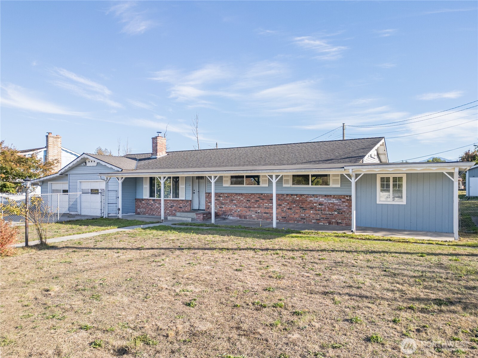 642 Kitchen-Dick Road Sequim, WA 98382 - Photo 2 of 40 a view of a big house with a big yard and large trees