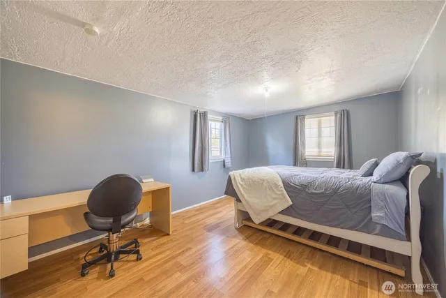 a living room with furniture and a chair
