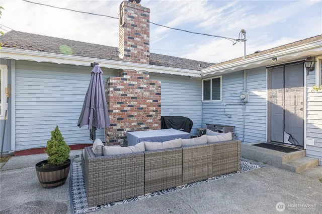 a view of a patio with couches and potted plants
