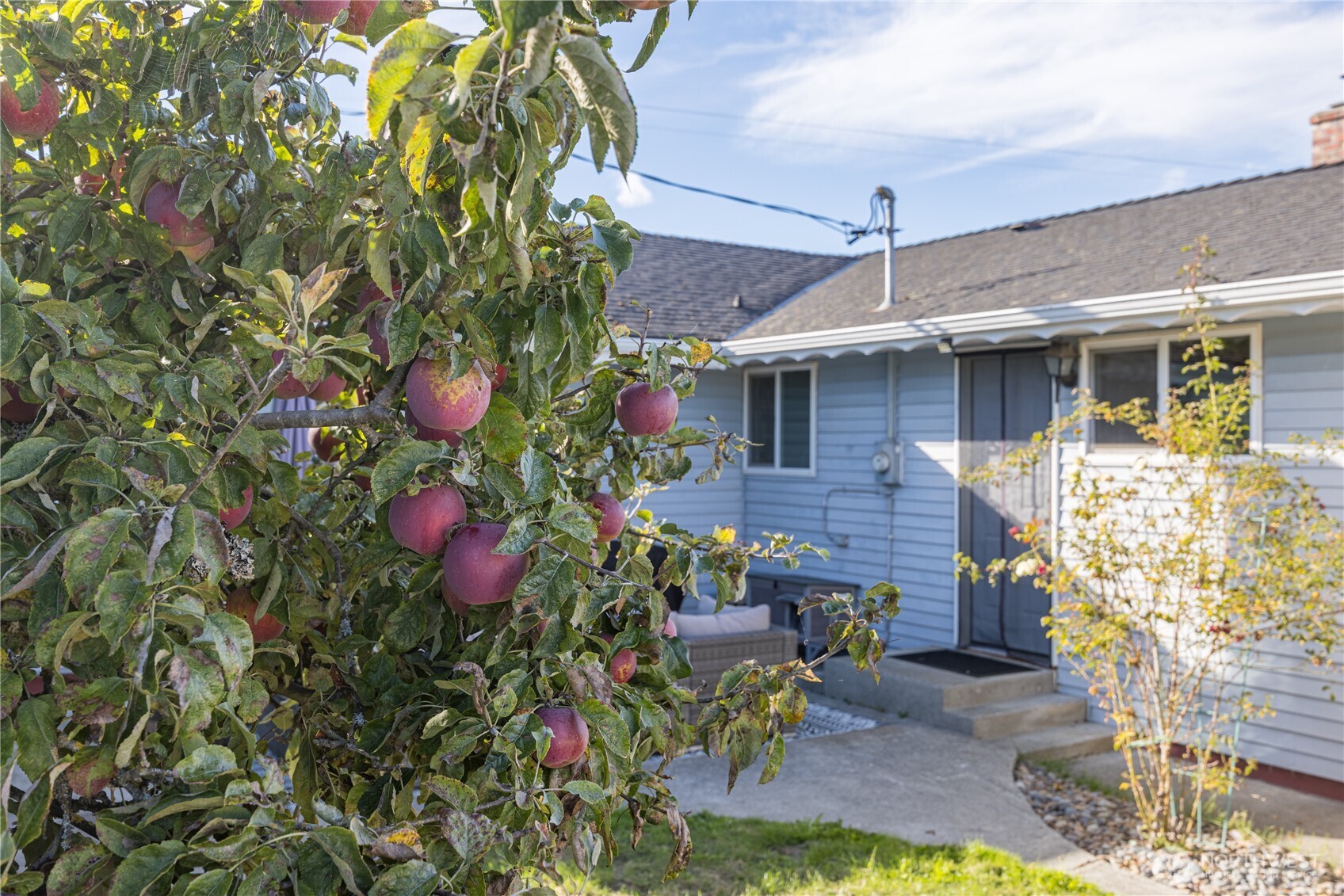 642 Kitchen-Dick Road Sequim, WA 98382 - Photo 29 of 40 a front view of a house with a yard and seating area
