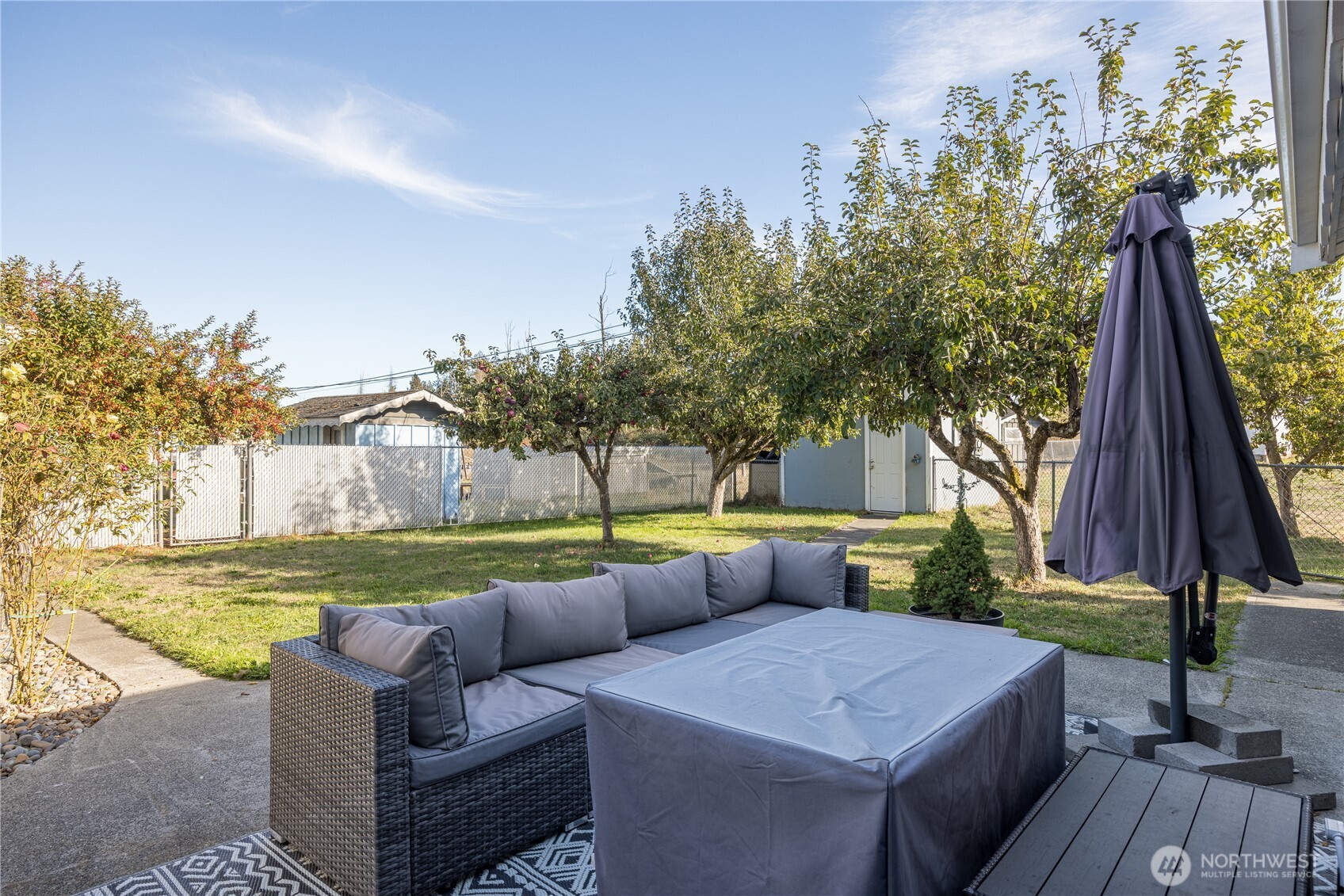 642 Kitchen-Dick Road Sequim, WA 98382 - Photo 31 of 40 a view of backyard with outdoor seating and trees