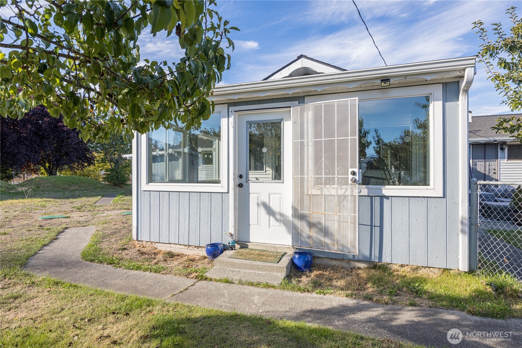 642 Kitchen-Dick Road Sequim, WA 98382 - Photo 32 of 40 a front view of a house with a yard