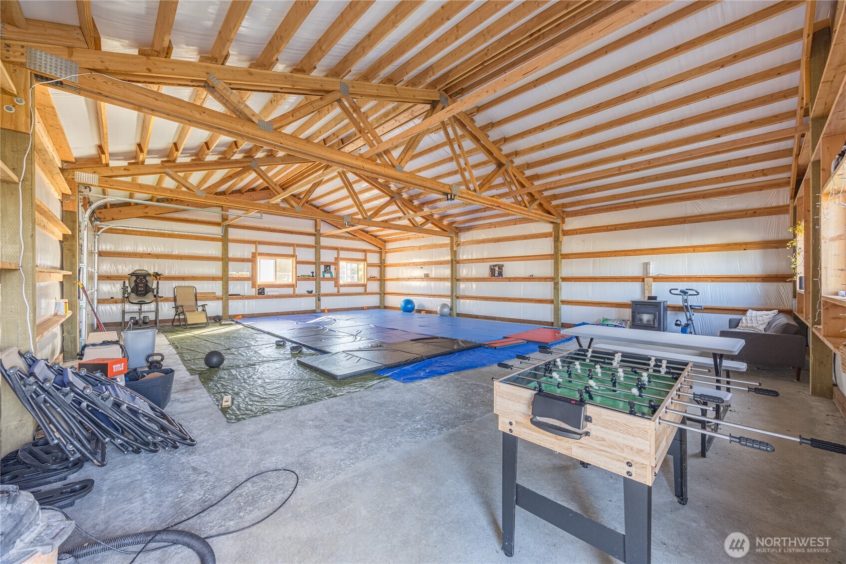 642 Kitchen-Dick Road Sequim, WA 98382 - Photo 34 of 40 a view of a patio with table and chairs and potted plants