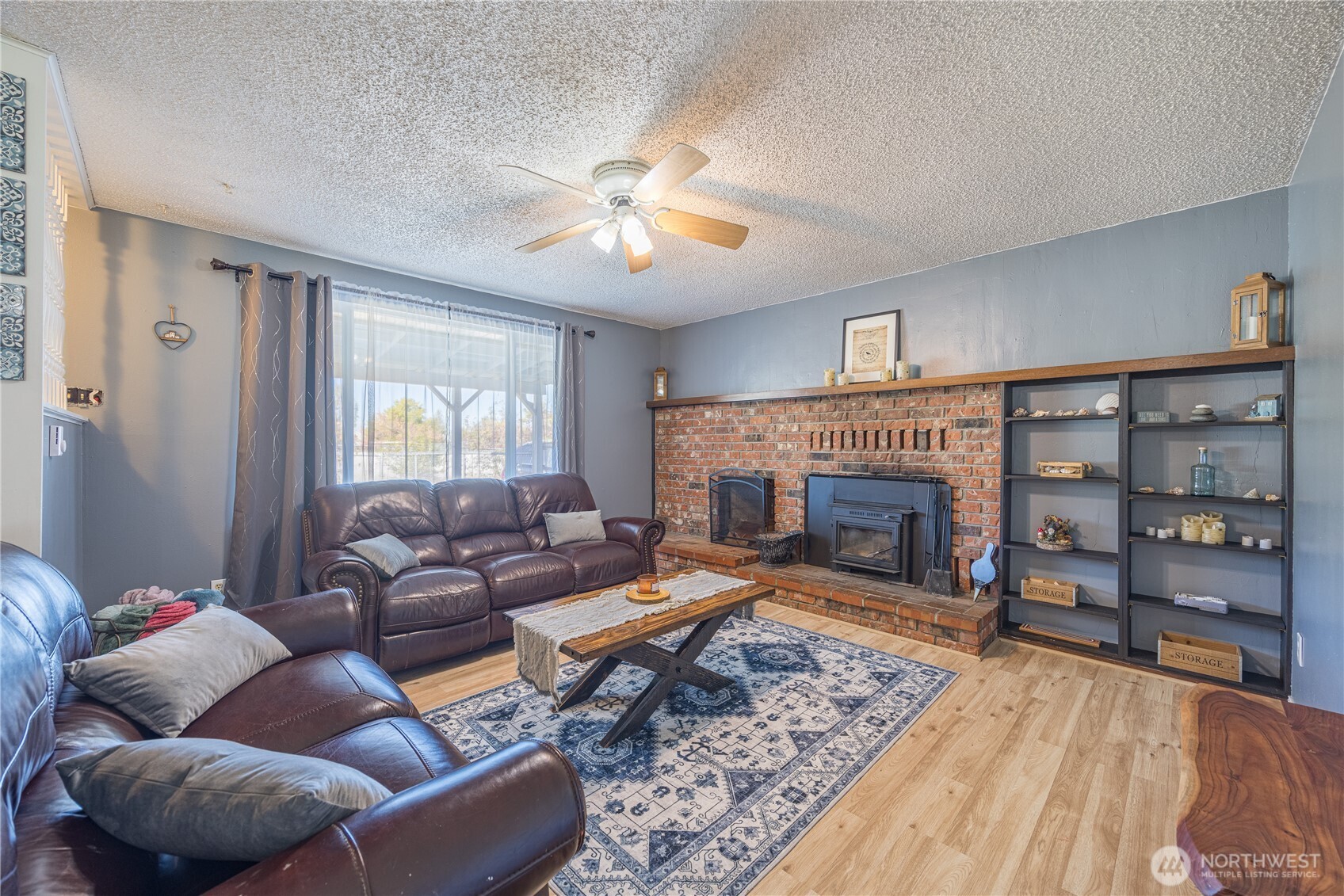 642 Kitchen-Dick Road Sequim, WA 98382 - Photo 4 of 40 a living room with furniture and a fireplace