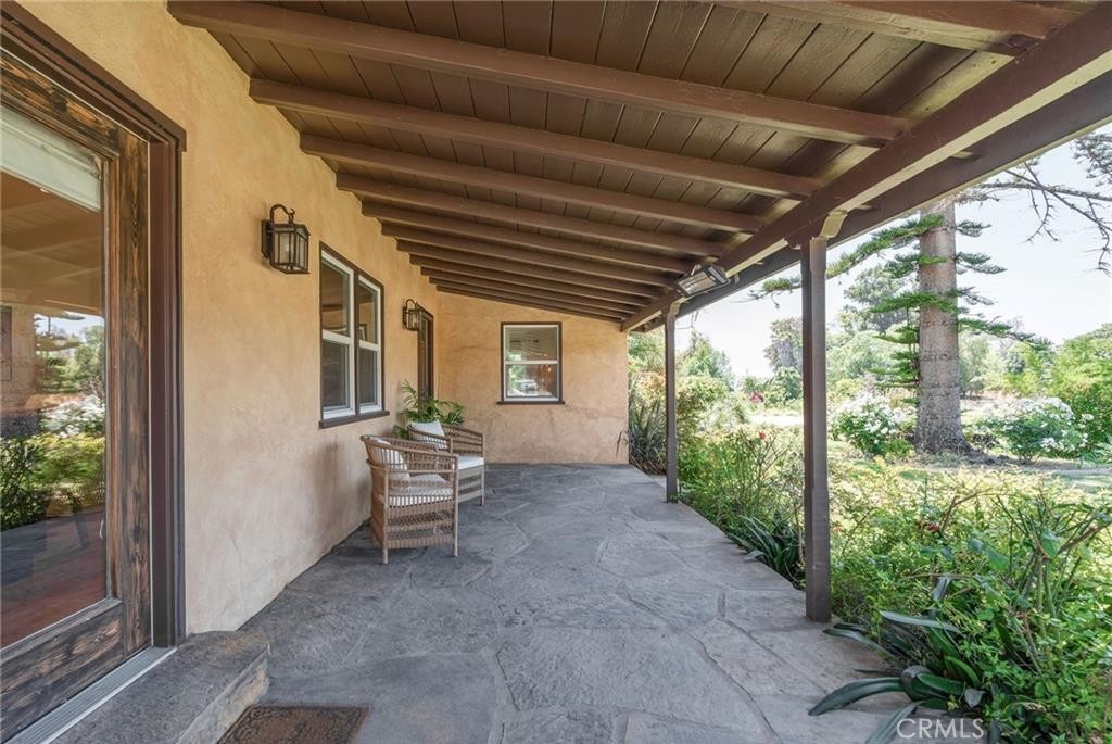 1955 Friendly Drive Vista, CA 92084 - Photo 12 of 75 a view of a porch with furniture and floor to ceiling window