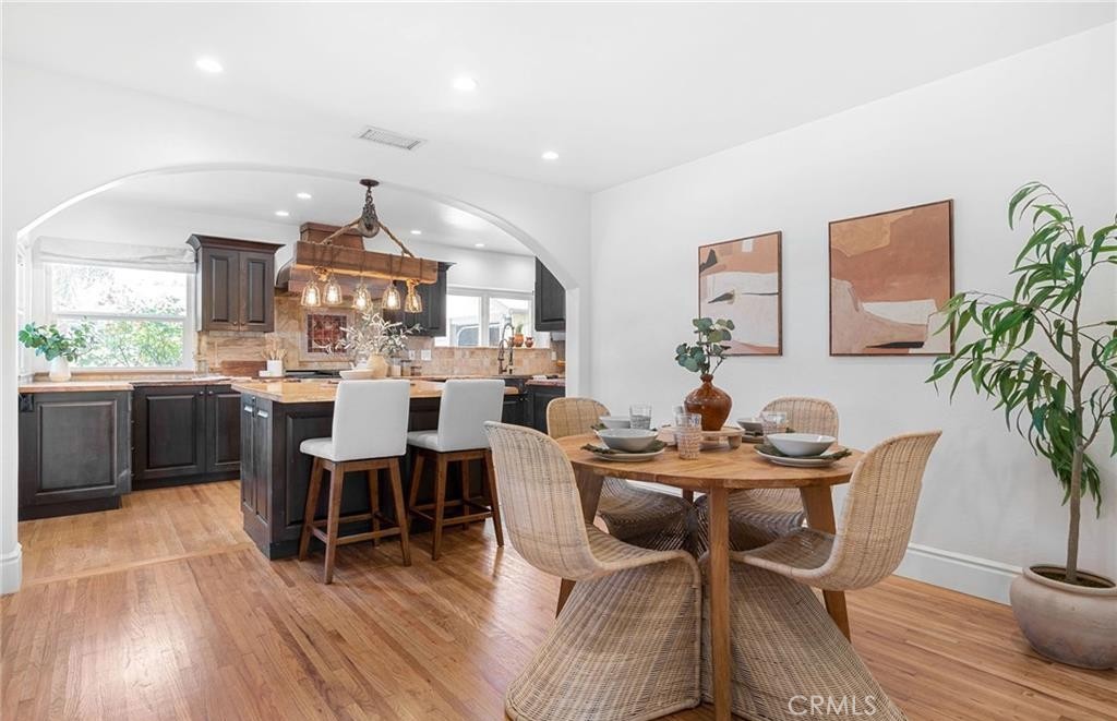 1955 Friendly Drive Vista, CA 92084 - Photo 15 of 75 a view of a dining room with furniture and wooden floor