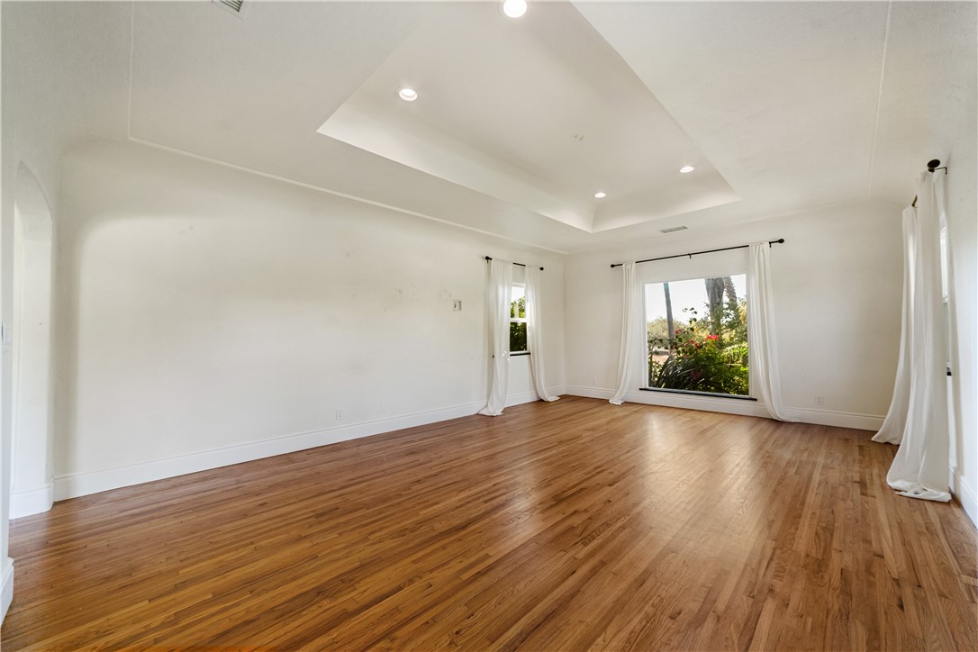 1955 Friendly Drive Vista, CA 92084 - Photo 23 of 75 an empty room with window and wooden floor