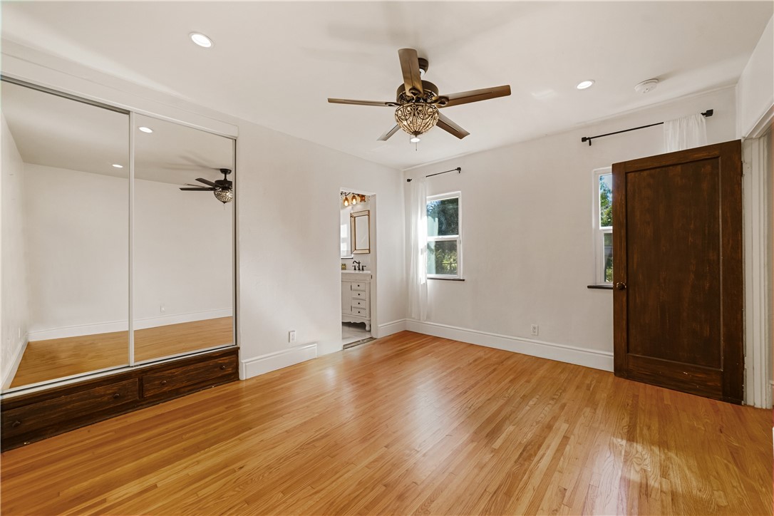 1955 Friendly Drive Vista, CA 92084 - Photo 27 of 75 a view of empty room with wooden floor and fan