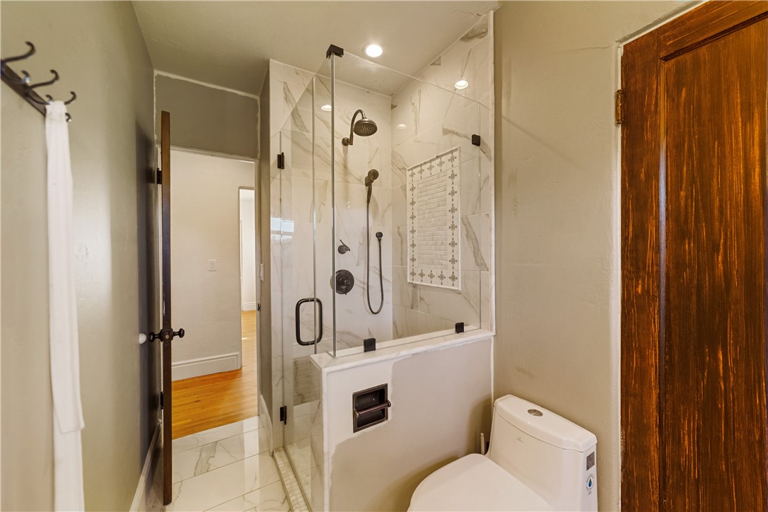 1955 Friendly Drive Vista, CA 92084 - Photo 29 of 75 a bathroom with a shower toilet and sink