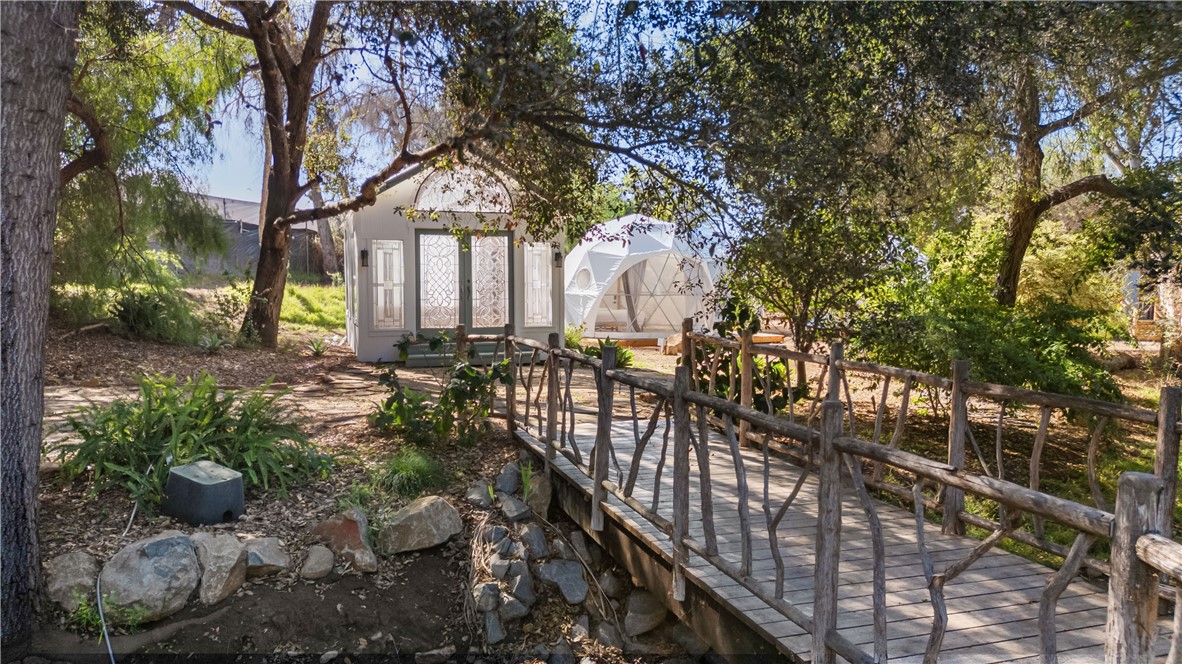 1955 Friendly Drive Vista, CA 92084 - Photo 32 of 75 a view of a house with large trees and plants