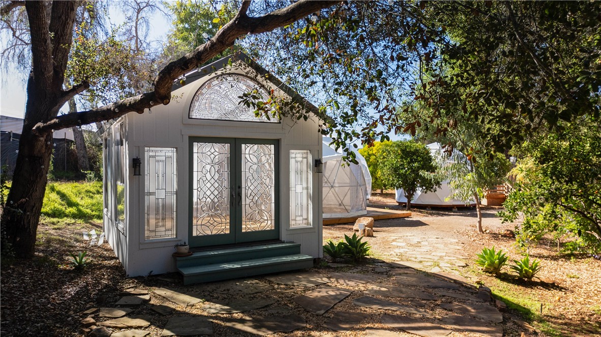 1955 Friendly Drive Vista, CA 92084 - Photo 33 of 75 a front view of a house with garden