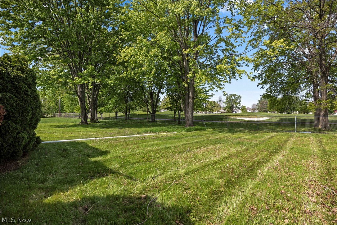 722 Jaycox Road Avon Lake, OH 44012 - Photo 42 of 48 Expansive lawn area featuring mature trees and a distant golf course sand trap