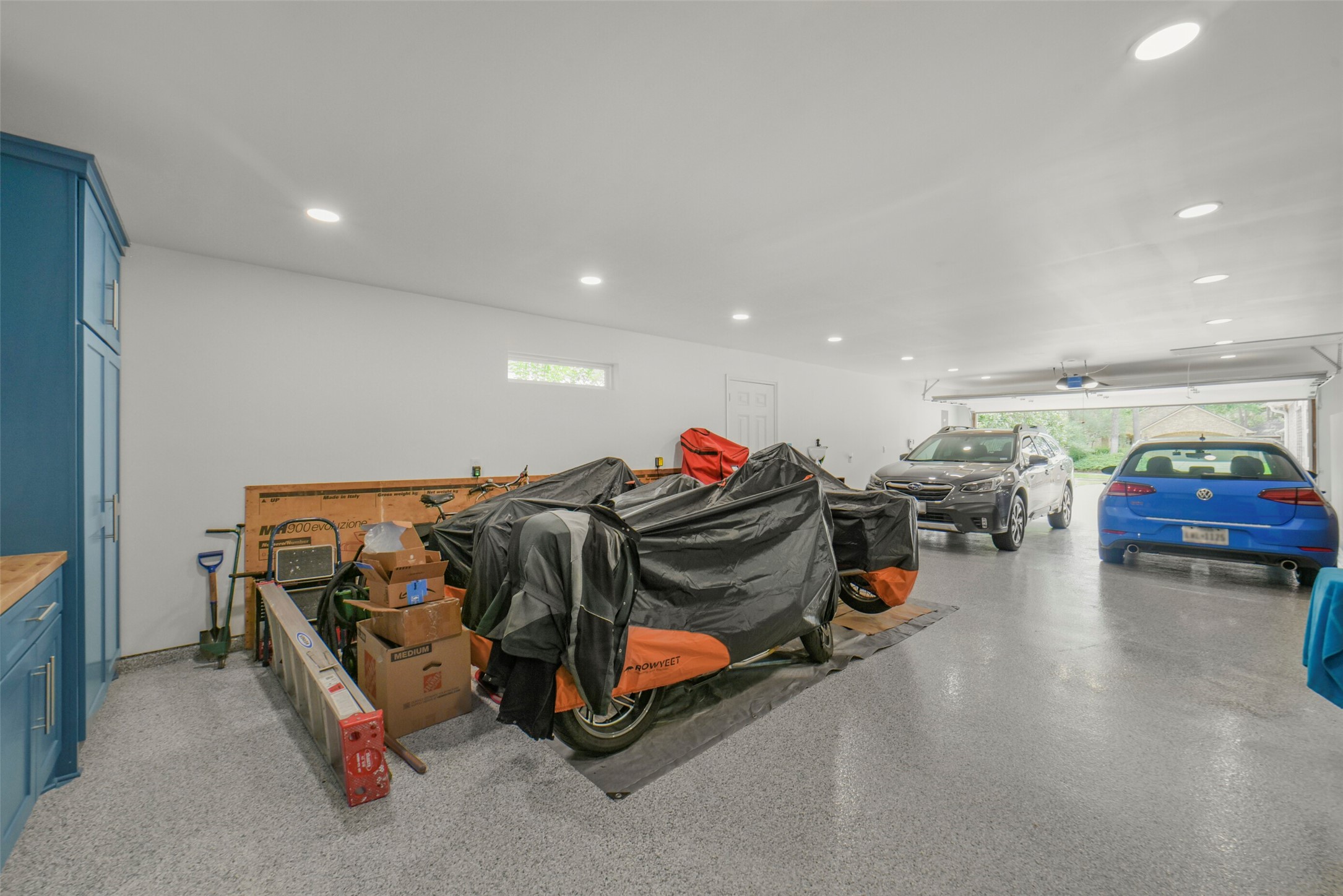 1310 Lambourne Circle Spring, TX 77379 - Photo 48 of 50 epoxy flooring and unfinished storage overhead with lighting