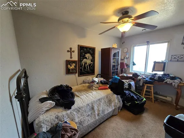 a bed room with a bed and a chandelier