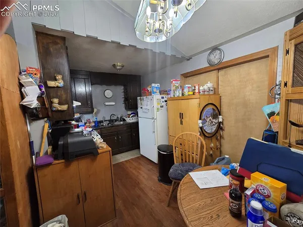 a living room with furniture and a clock