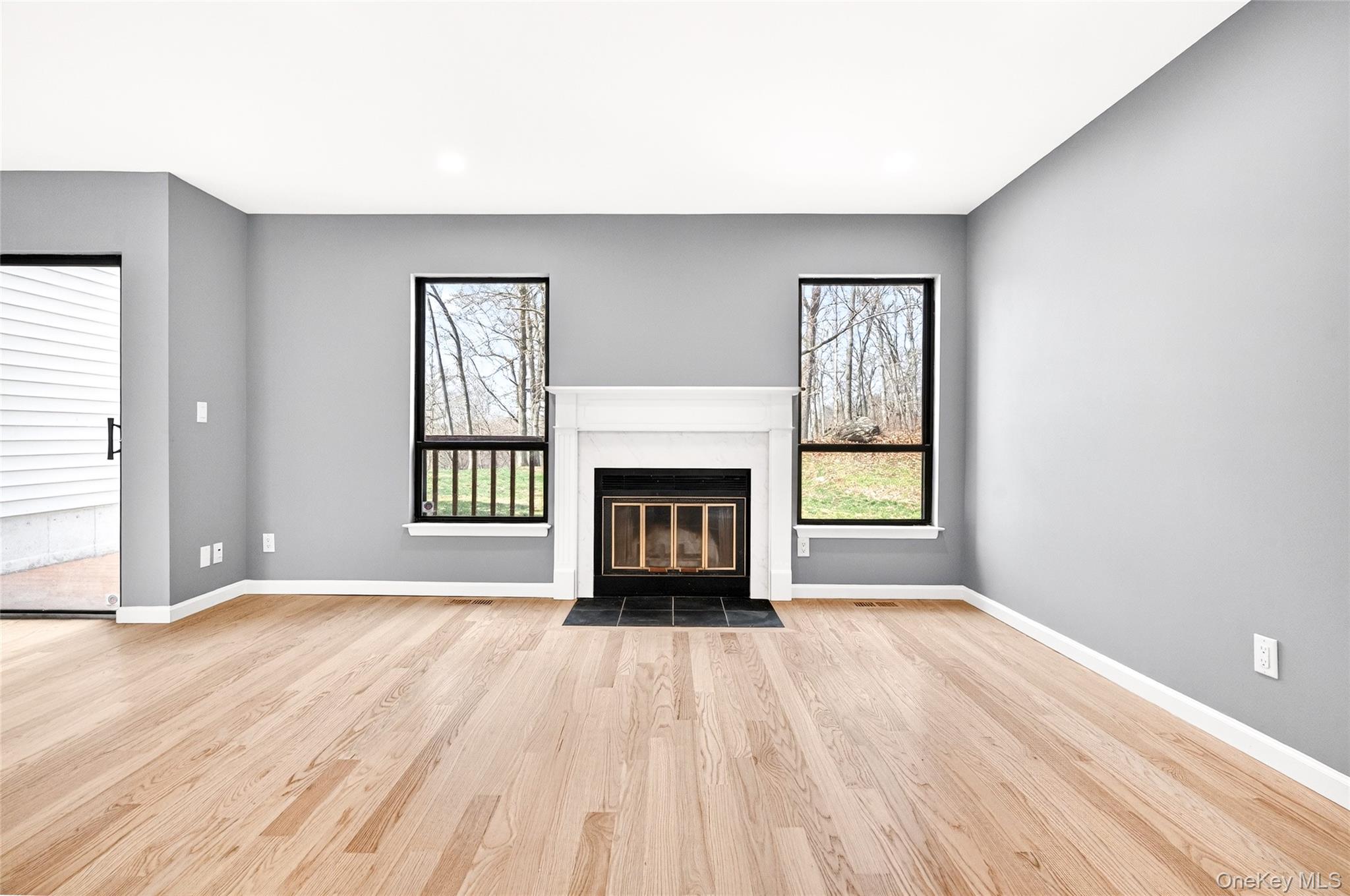 14 Bridle Path Road Ossining, NY 10562 - Photo 11 of 45 a view of an empty room with a window and fireplace