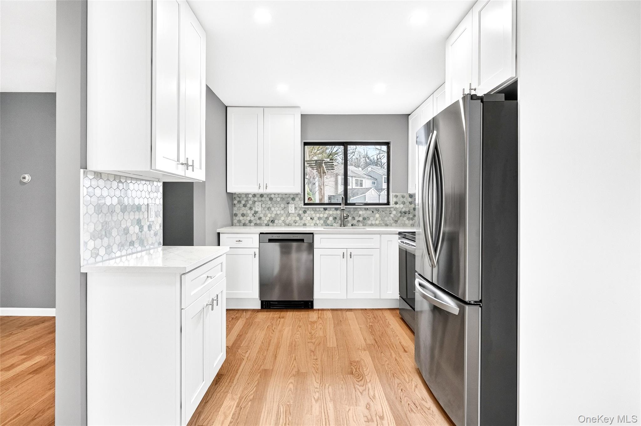 14 Bridle Path Road Ossining, NY 10562 - Photo 13 of 45 a kitchen with a stove a sink and a refrigerator