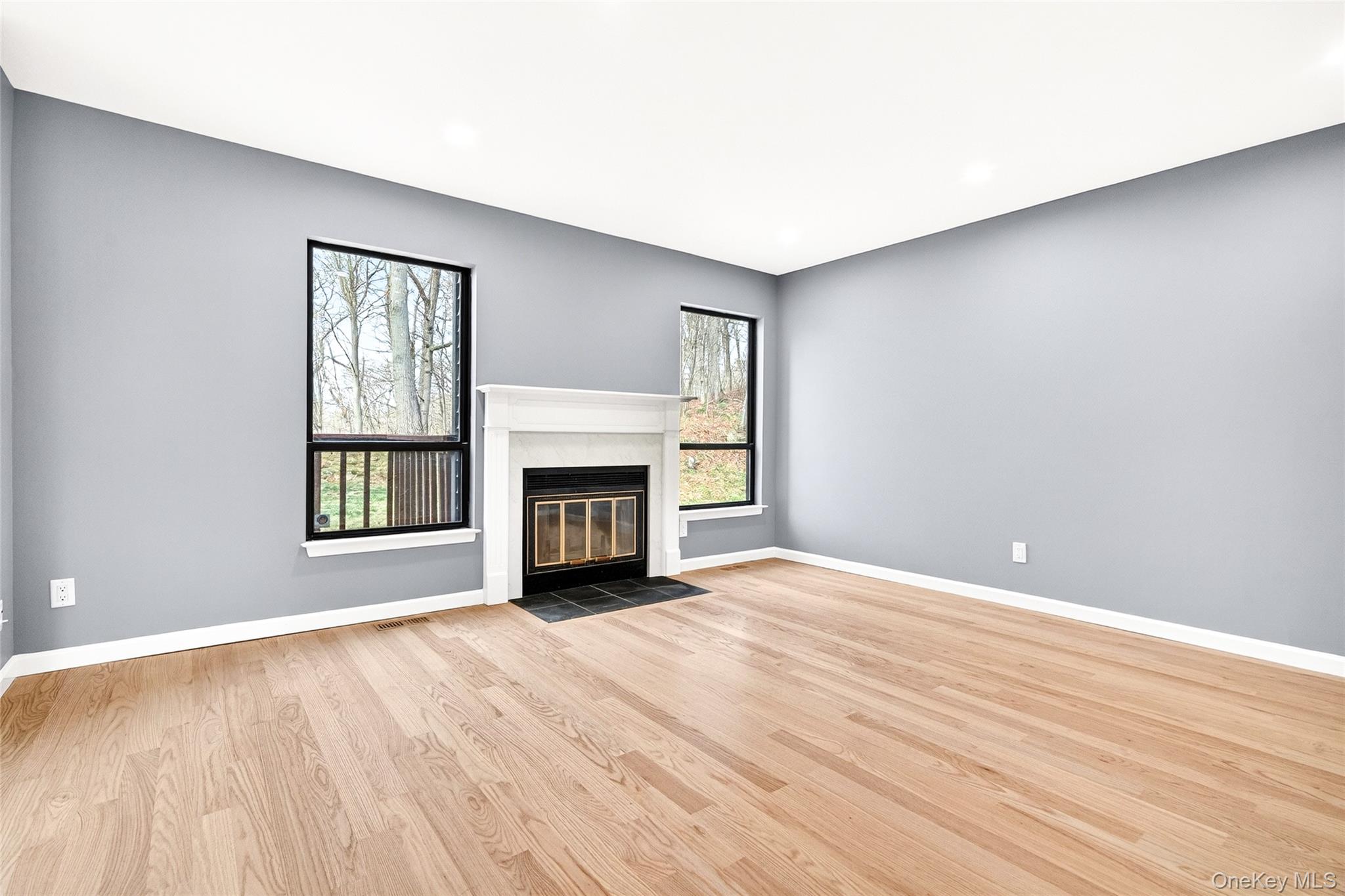 14 Bridle Path Road Ossining, NY 10562 - Photo 16 of 45 a view of empty room with wooden floor and fireplace