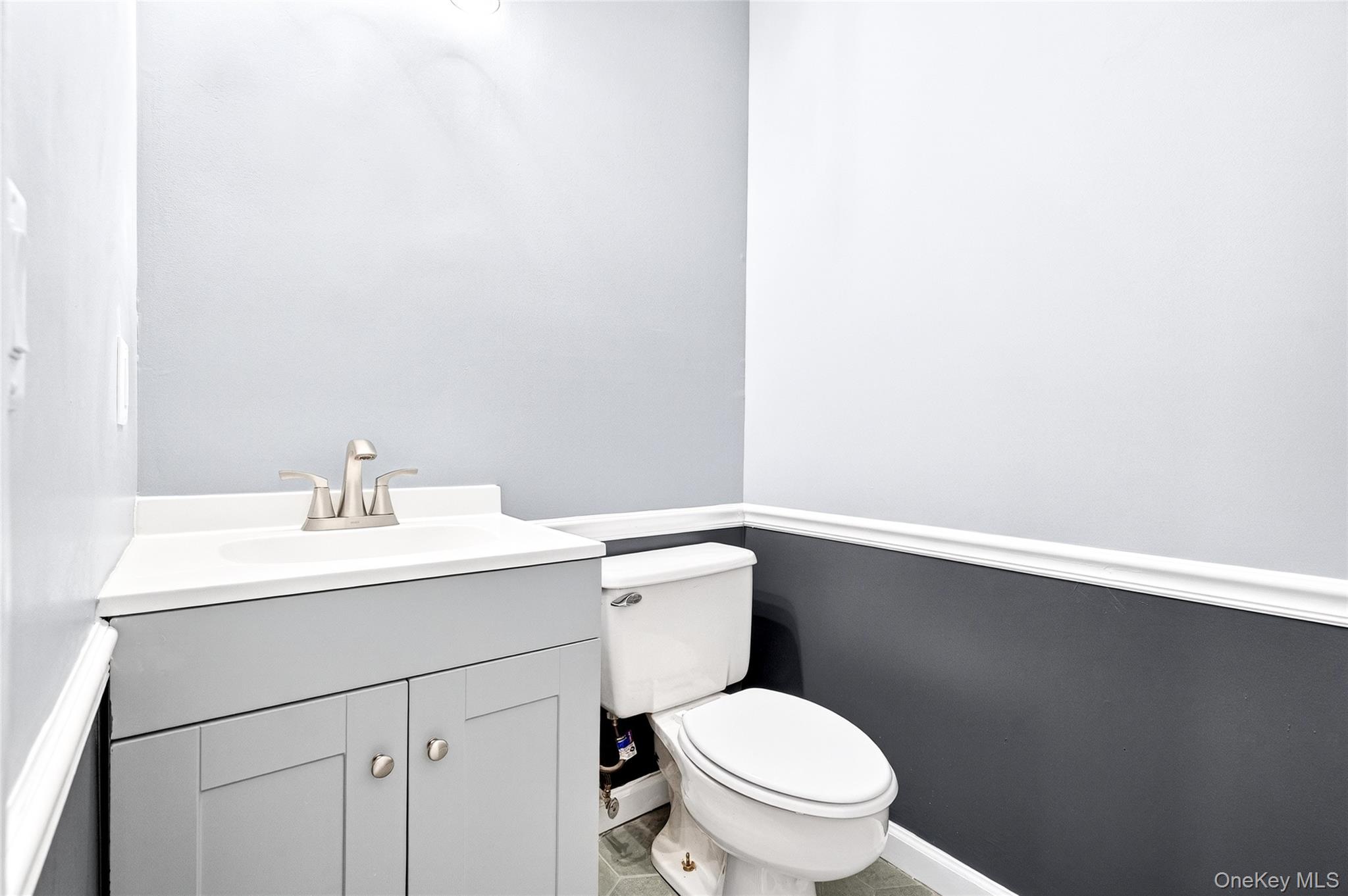 14 Bridle Path Road Ossining, NY 10562 - Photo 19 of 45 a bathroom with a sink a toilet and a mirror