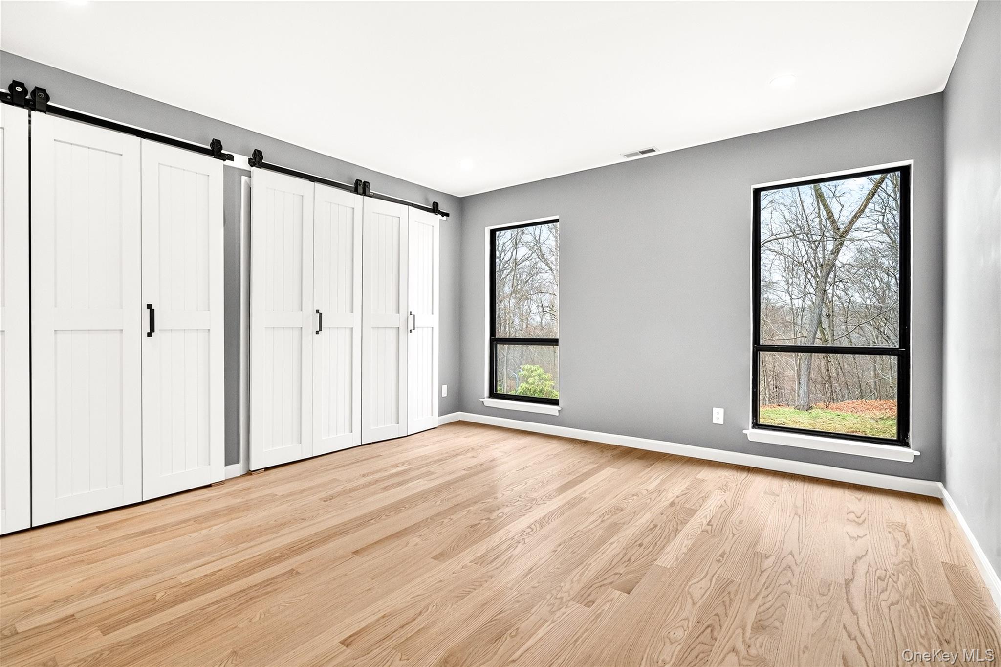 14 Bridle Path Road Ossining, NY 10562 - Photo 24 of 45 a view of an empty room with a window and wooden floor