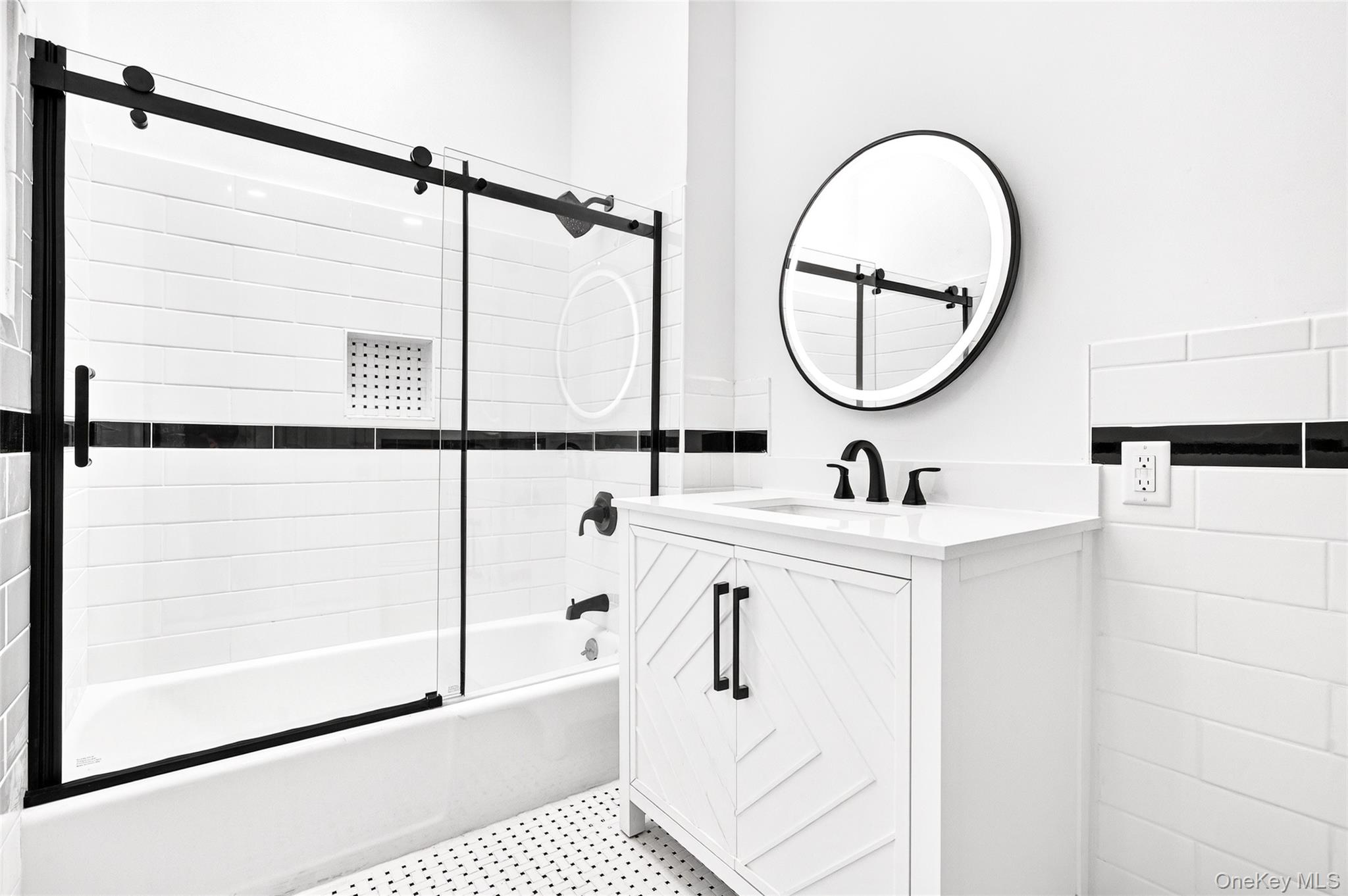 14 Bridle Path Road Ossining, NY 10562 - Photo 26 of 45 a bathroom with a sink and a mirror