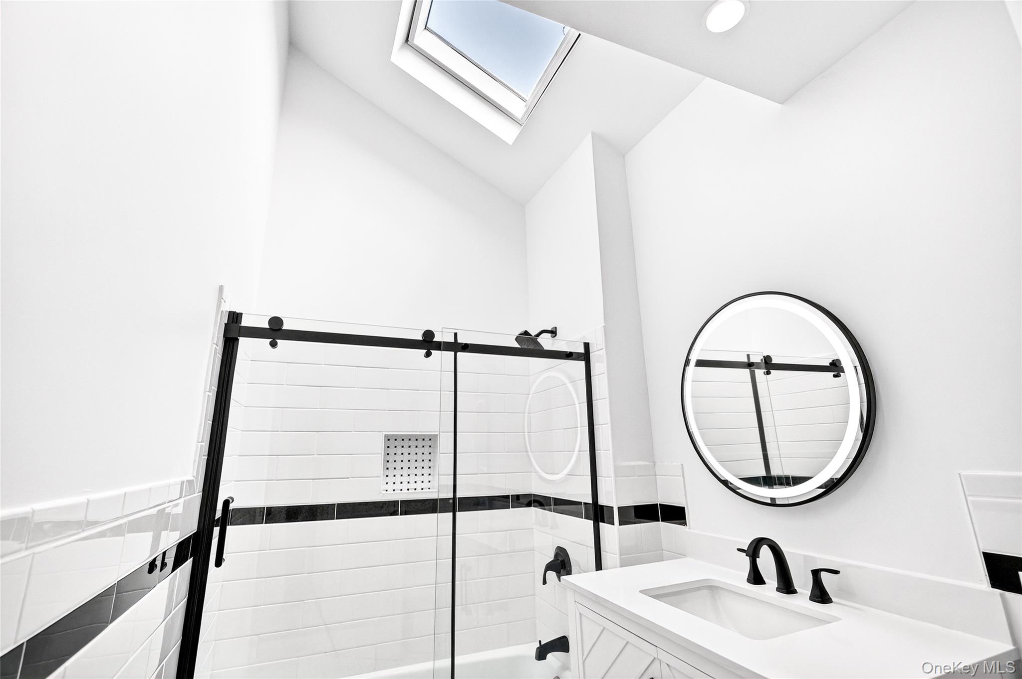 14 Bridle Path Road Ossining, NY 10562 - Photo 27 of 45 a bathroom with a sink and a mirror