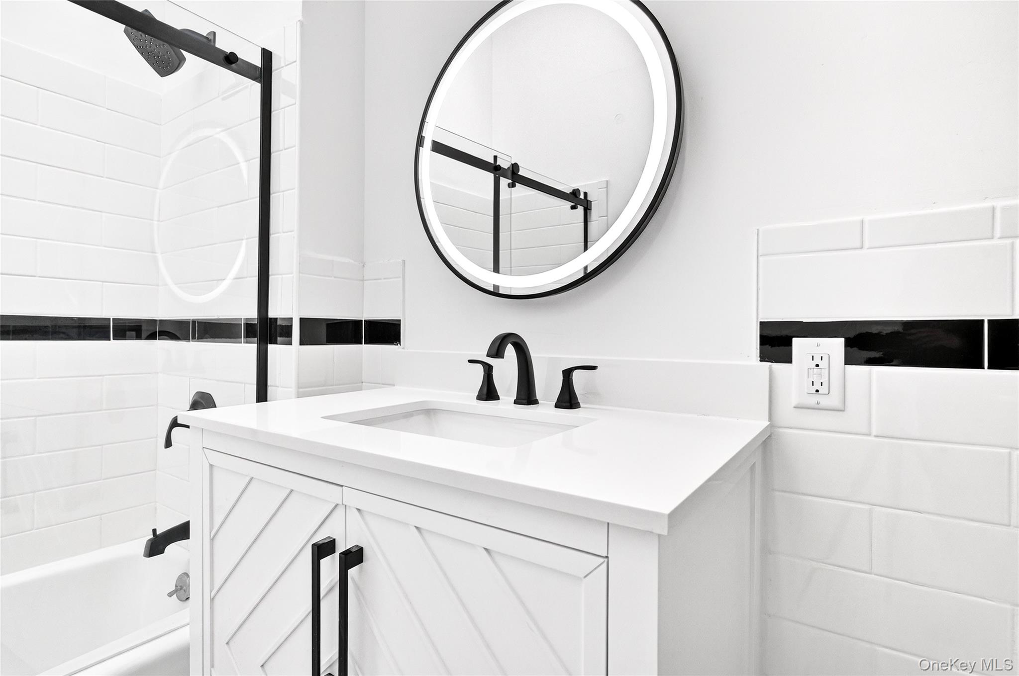 14 Bridle Path Road Ossining, NY 10562 - Photo 28 of 45 a bathroom with a sink and a mirror