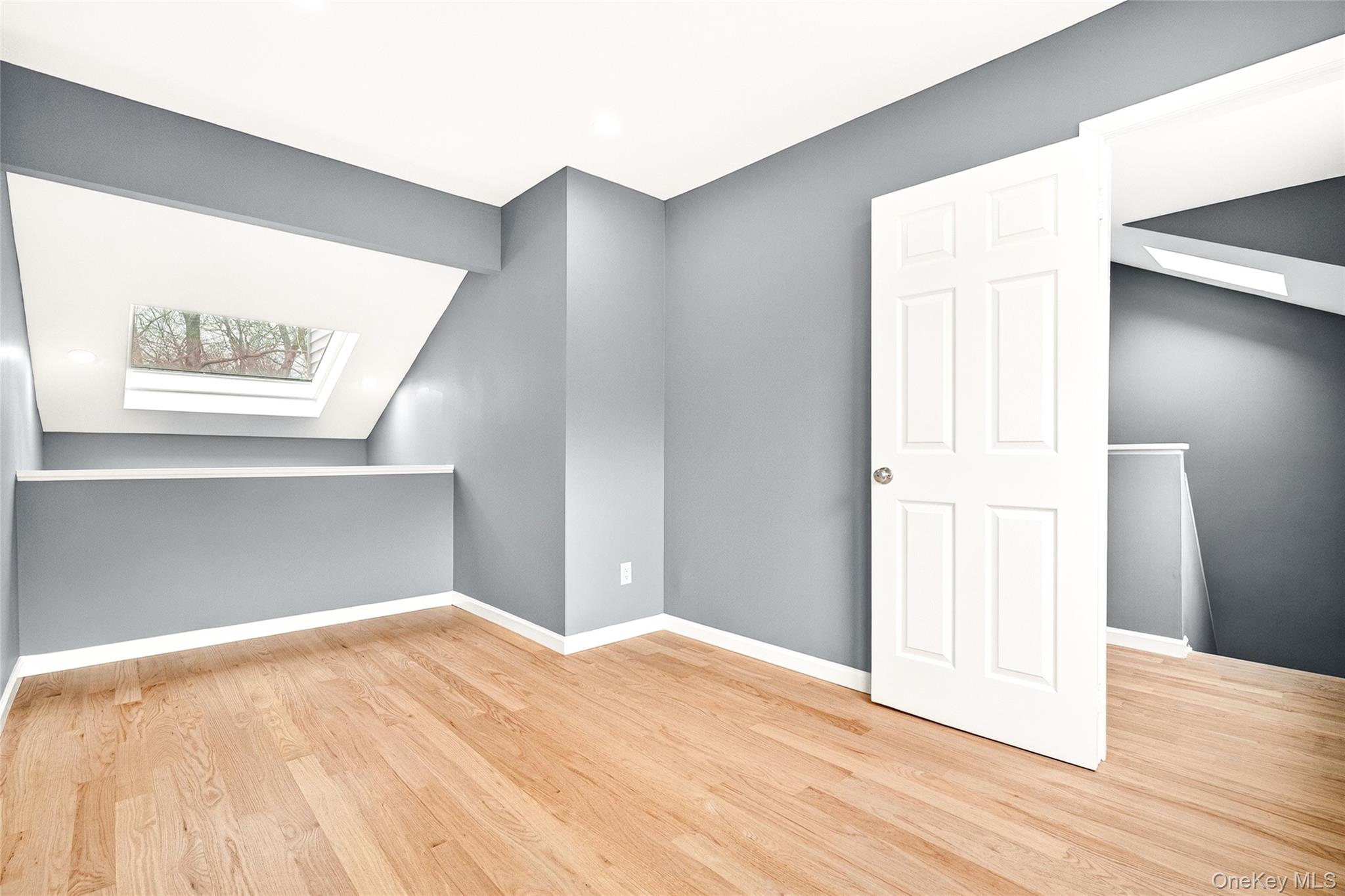 14 Bridle Path Road Ossining, NY 10562 - Photo 31 of 45 a view of an empty room with wooden floor